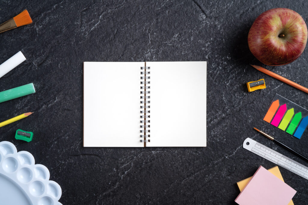 back school student design concept top view stationery slate black table background with copy space