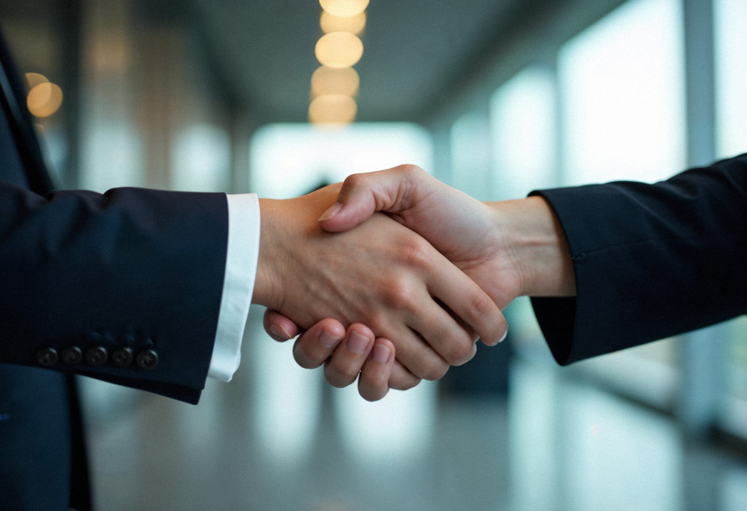 Why Sarbazo handshake two people business suits symbolizing successful agreement scaled
