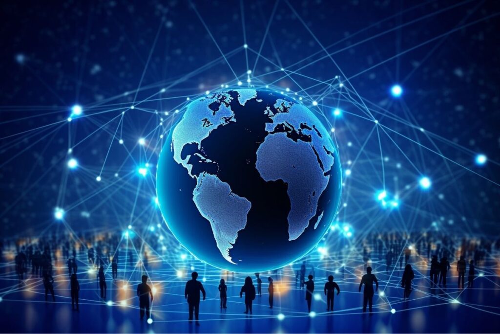 big blue going globe with people standing around it